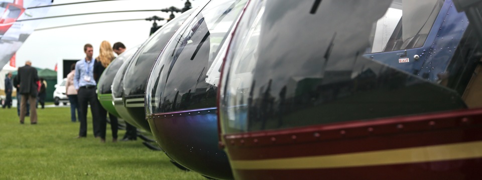 A row of helicopters on static display